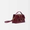 The large Bambino Cross-body metal flap bag