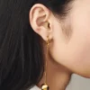 The Nodo earrings Asymmetric dangle earrings