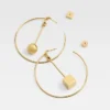 The Nodo hoops earrings Asymmetric hoop earrings The Nodo hoops earrings Asymmetric hoop earrings